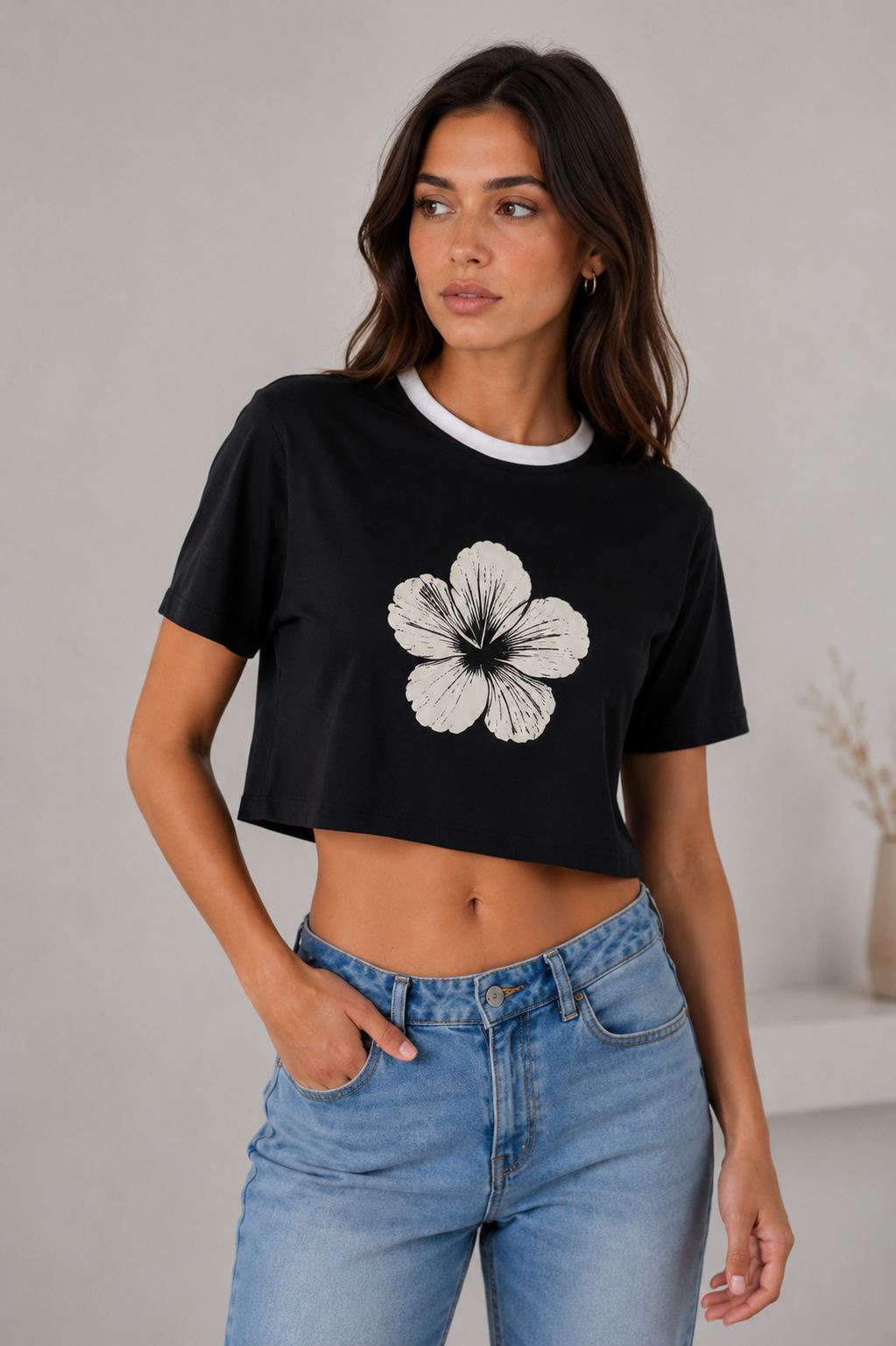 Cropped black ringer tee with flower graphic and jeans